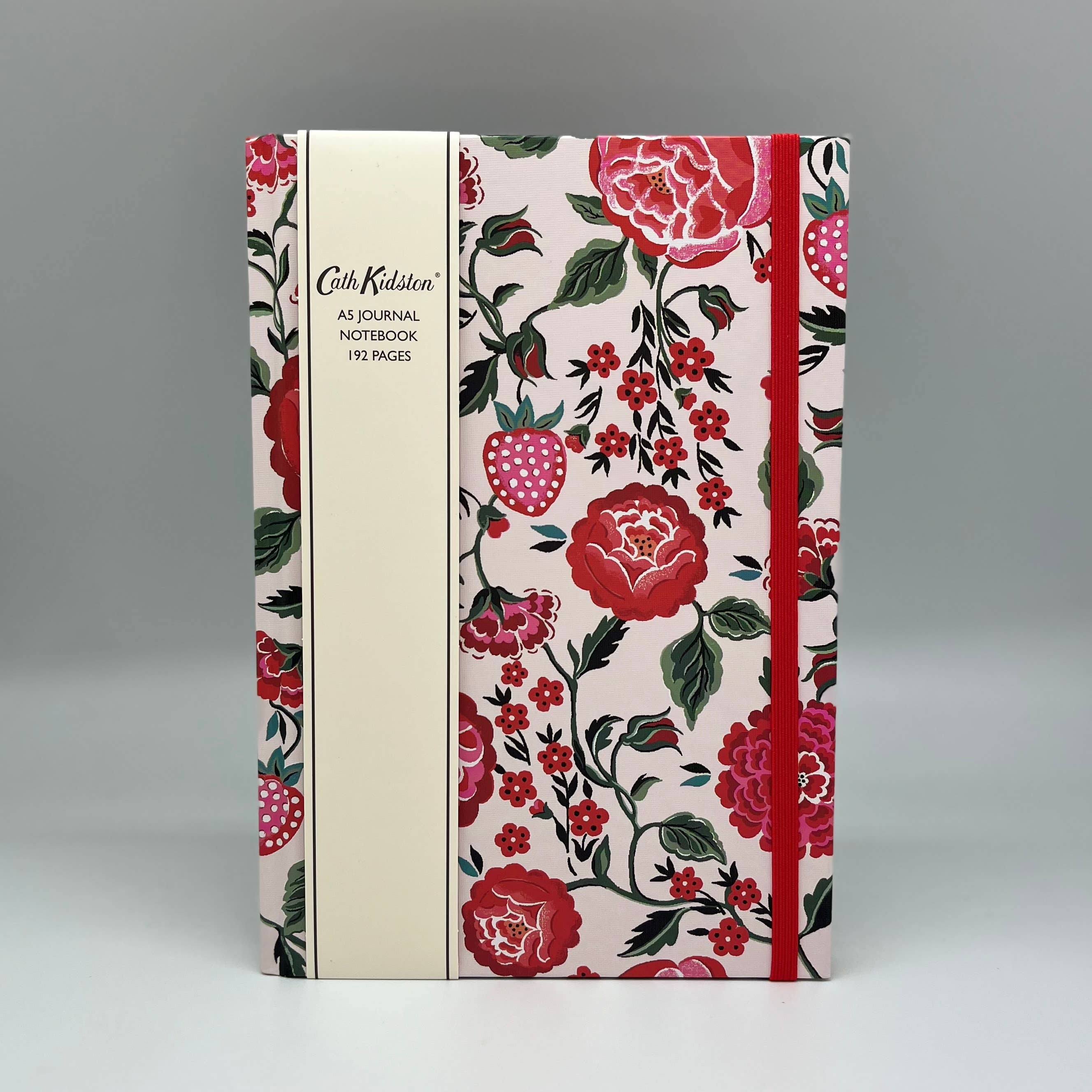Floral notebook with red and pink flowers on a gray background