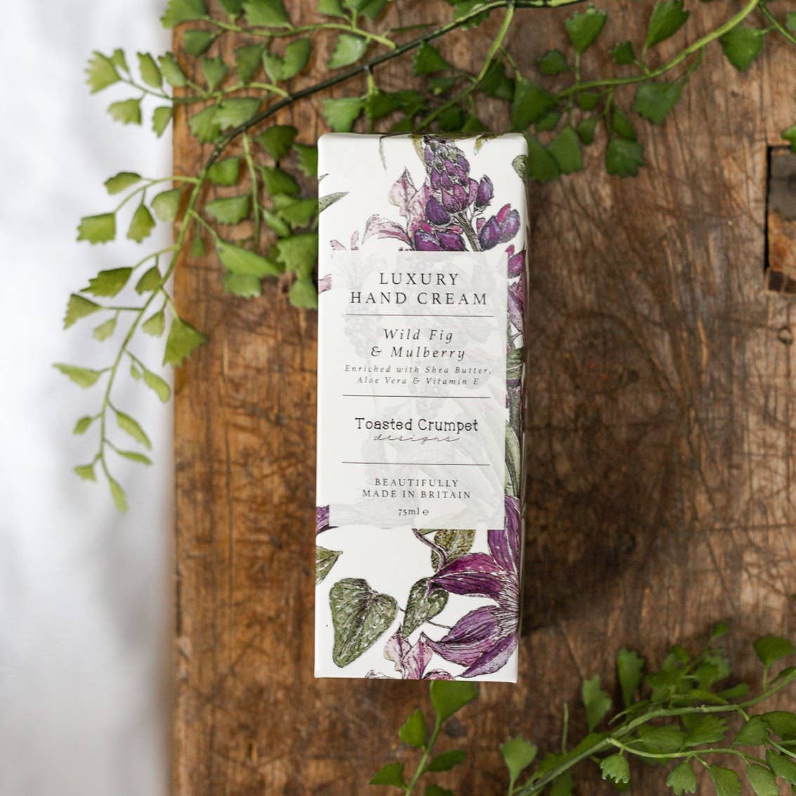 Luxury hand cream packaging with floral design. Wild Fig and Mulberry scent