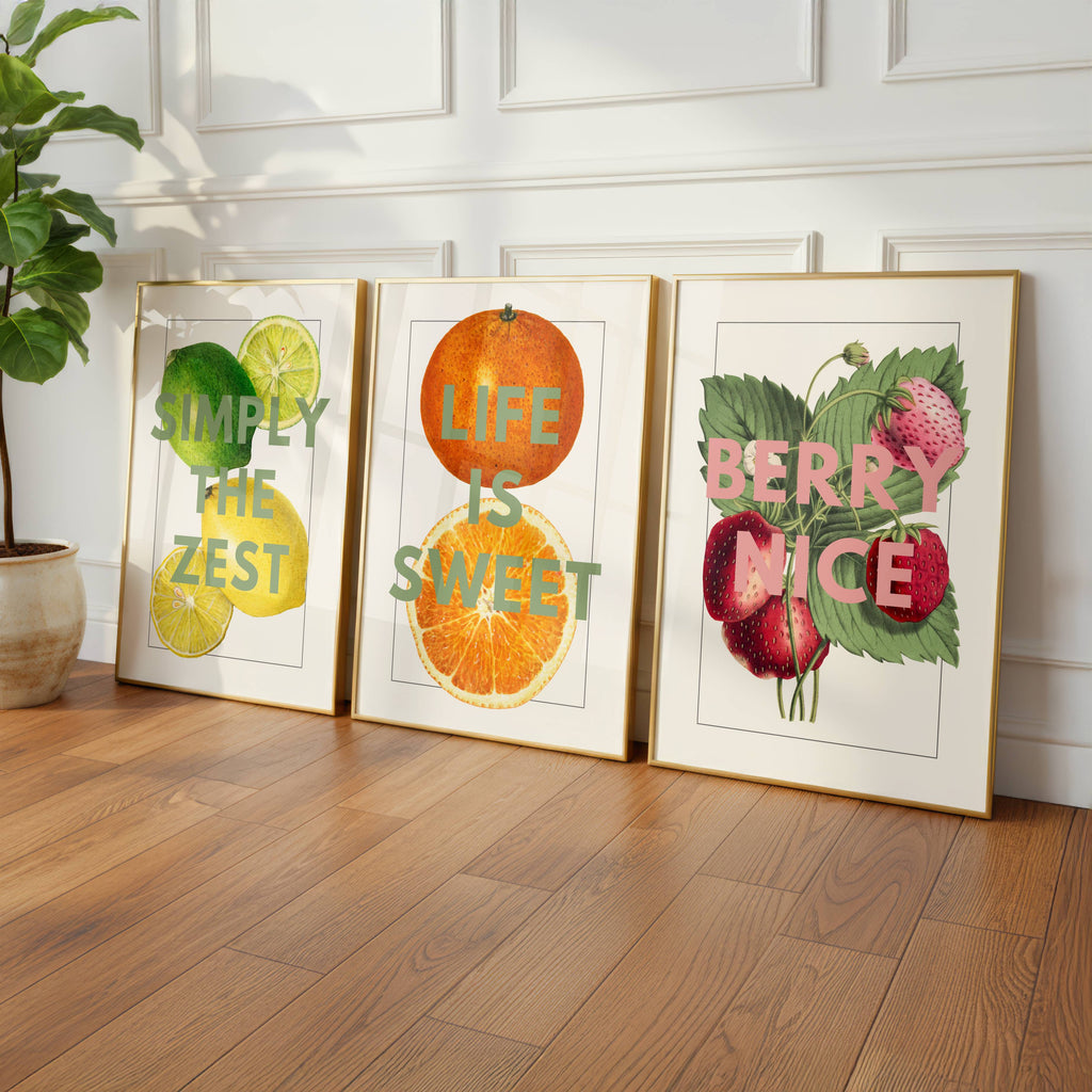 Fruit prints framed standing by the wall. Simply the Zest, Life is Sweet and Berry Nice