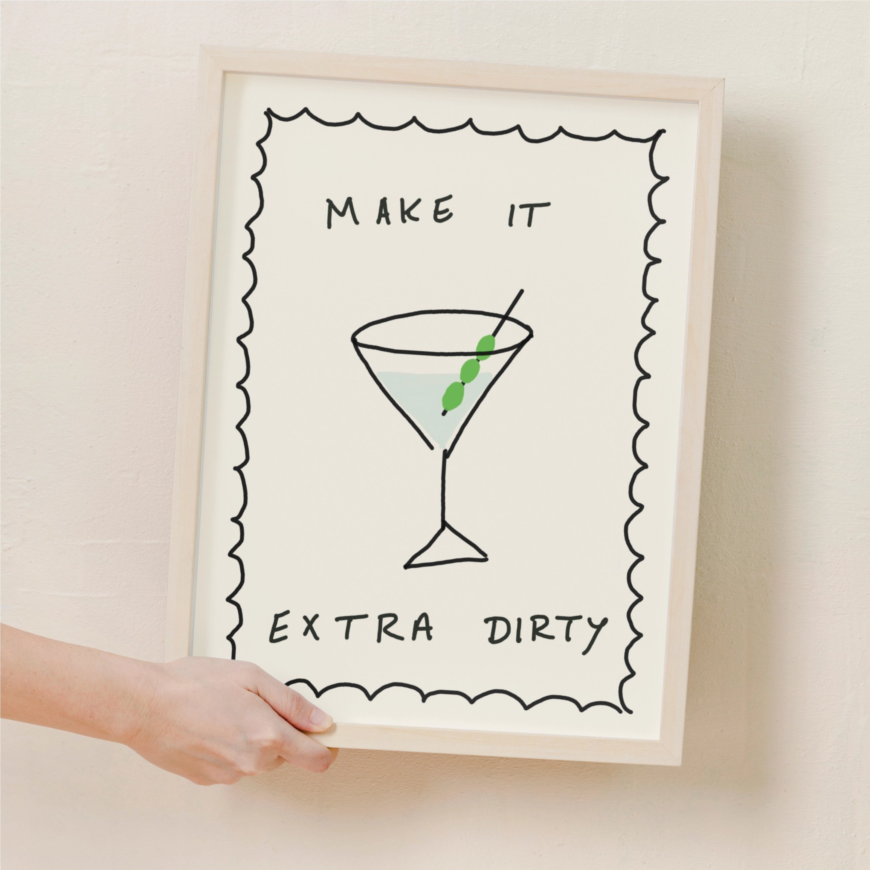  artwork with a martini cocktail illustration and text make it extra dirty on a beige background