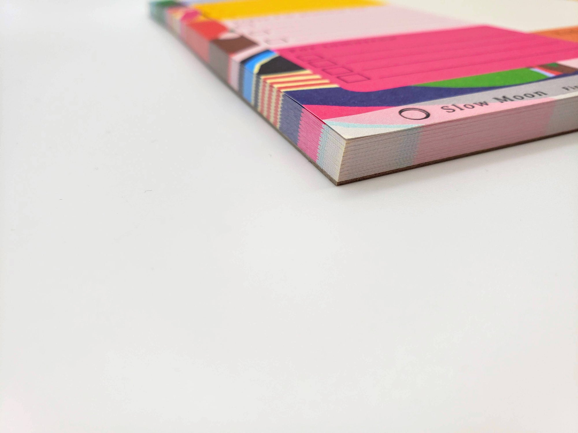 Colorful notebook with a geometric pattern on a white background