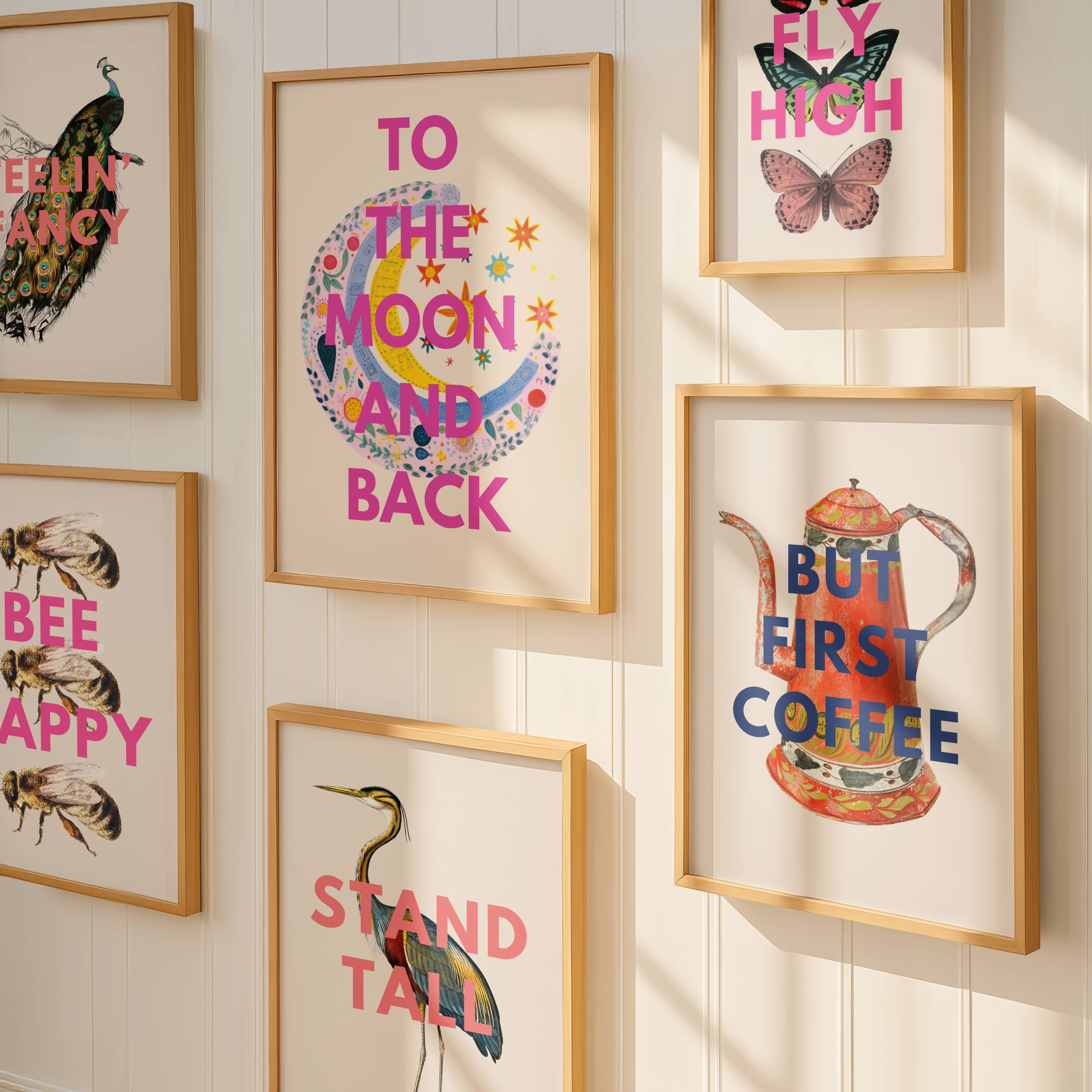 Framed prints with motivational phrases on a wall